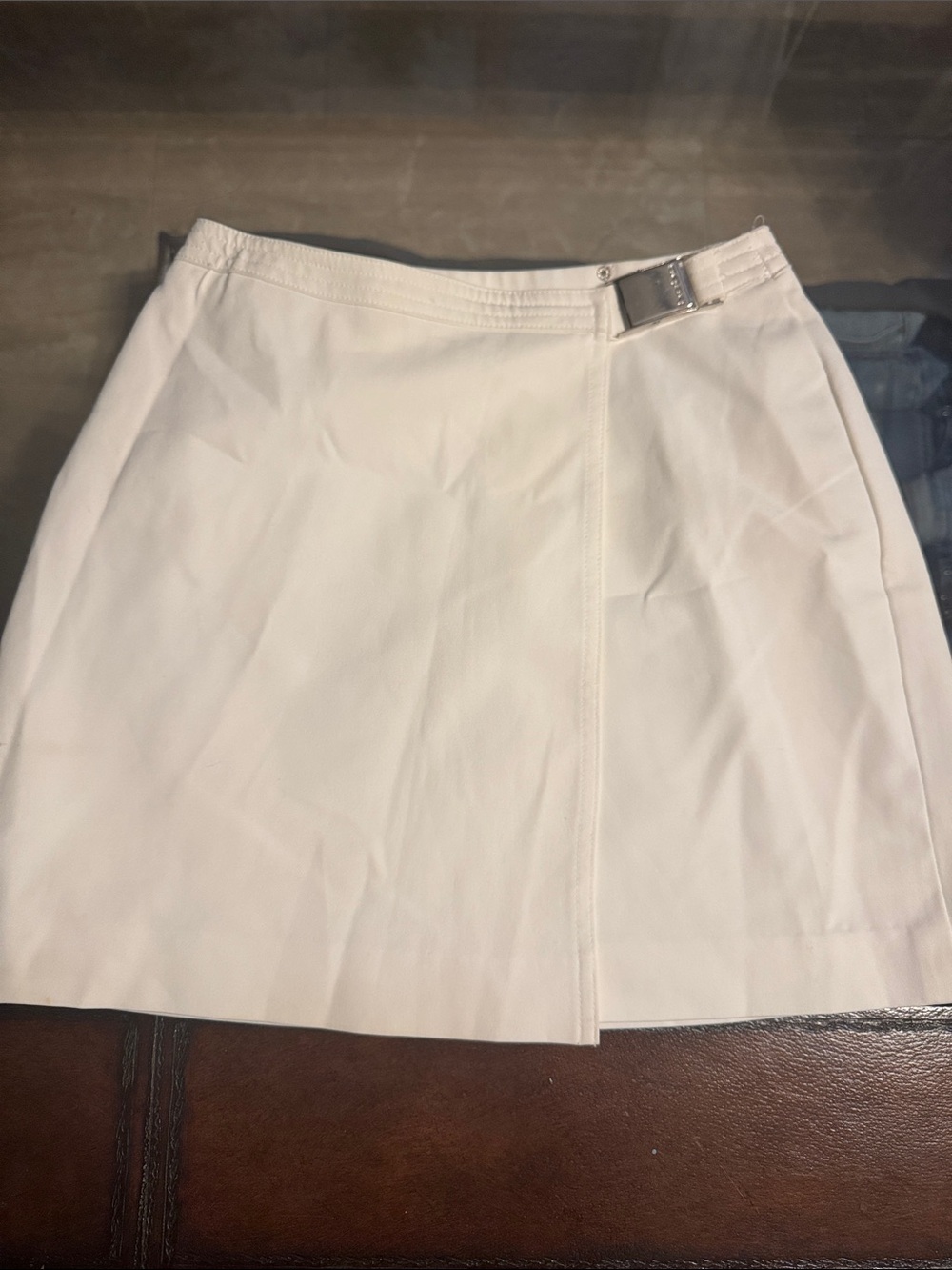 Vintage Bebe Crisp White Mini Skirt with Polished Buckle Detail